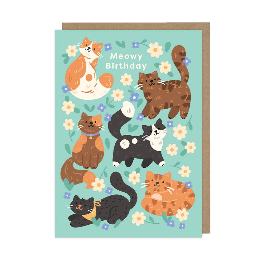 Greeting card with cartoon cats and flowers on a light blue background
