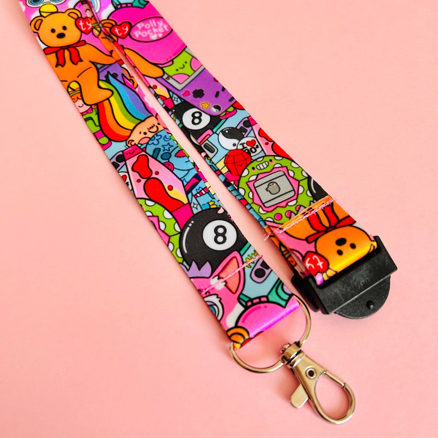 Colorful lanyard with cartoon characters on a pink background