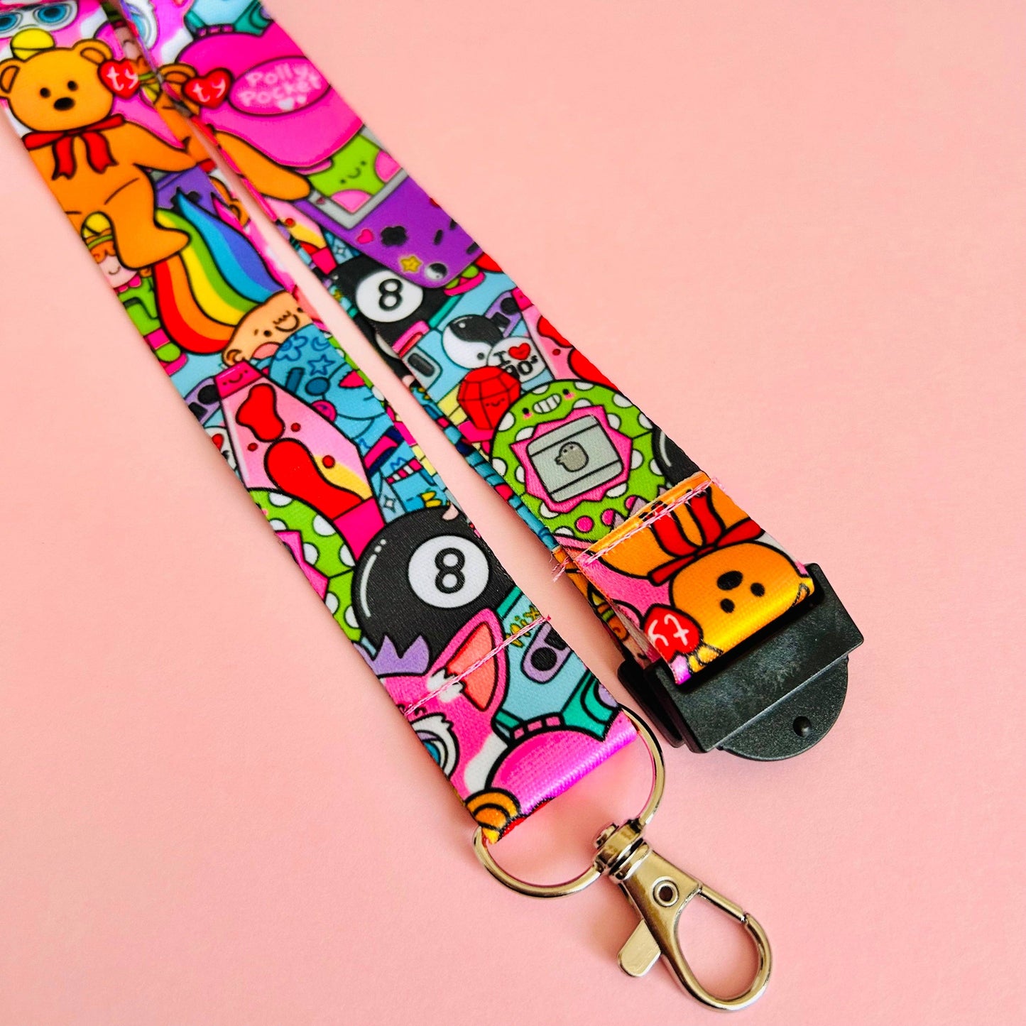 Colorful lanyard with cartoon characters on a pink background