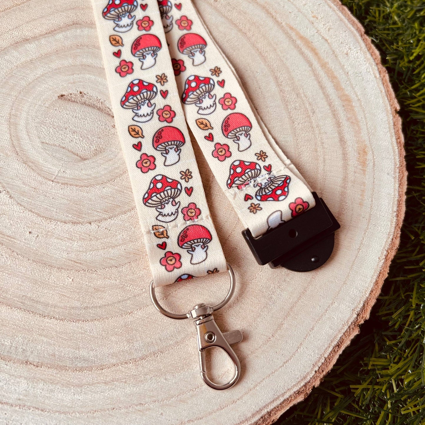 Lanyard with mushroom pattern on a wooden surface