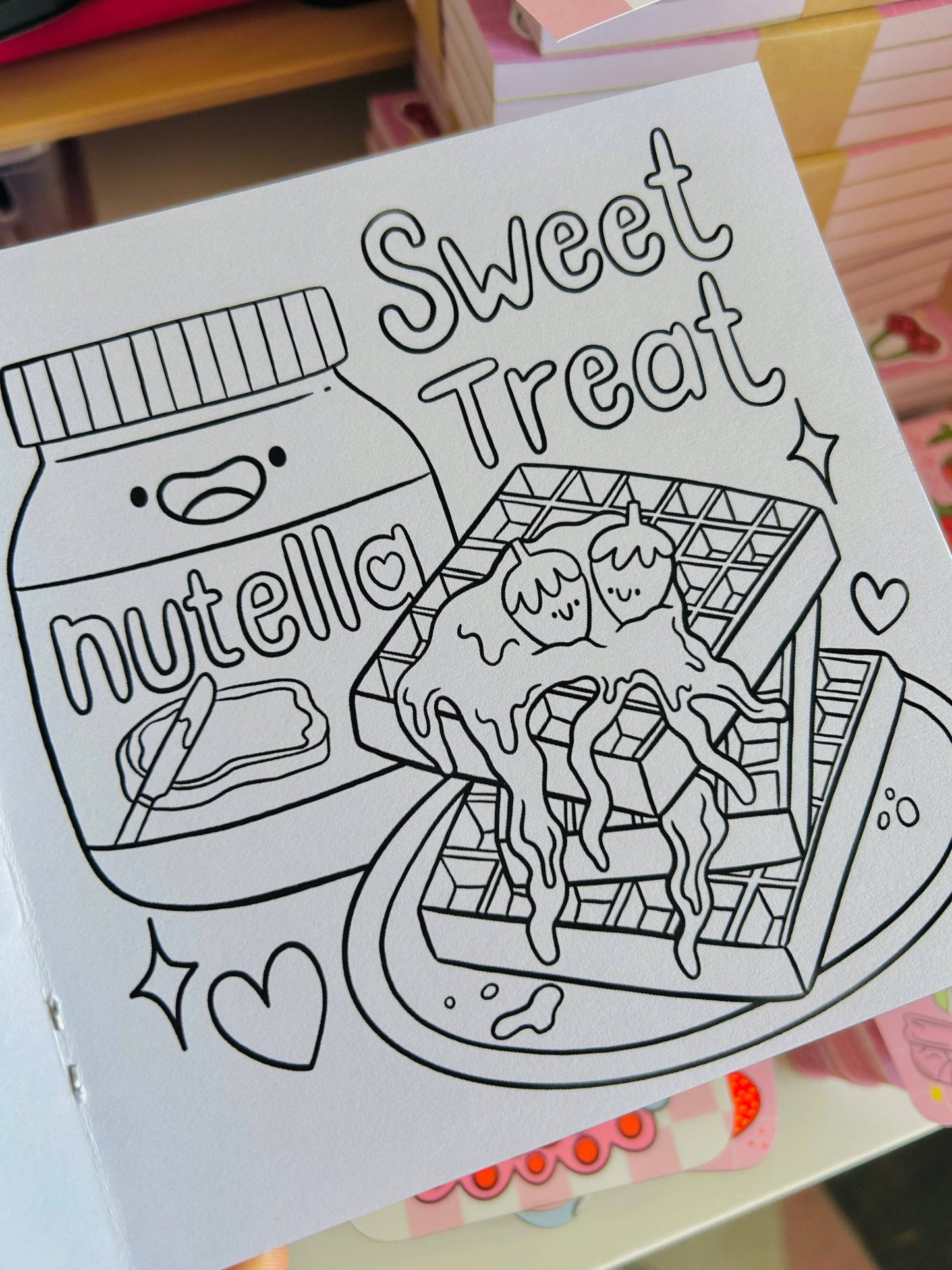Coloring book page with Nutella illustration and 'Sweet Treat' text.