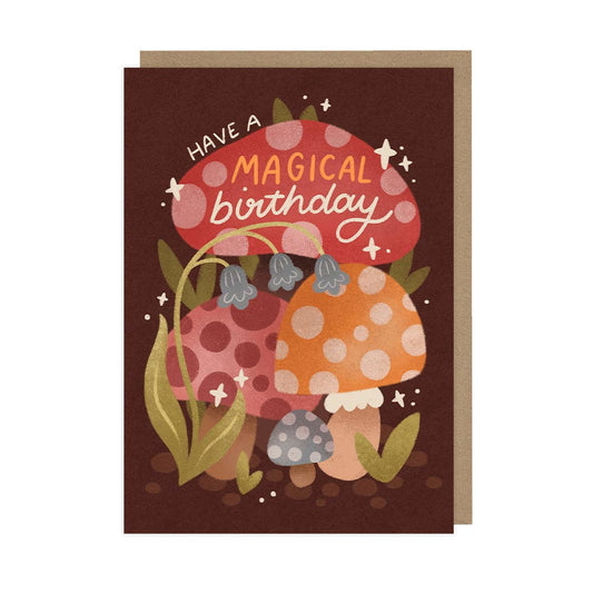 Greeting card with mushrooms and 'Have a Magical Birthday' text on a brown background