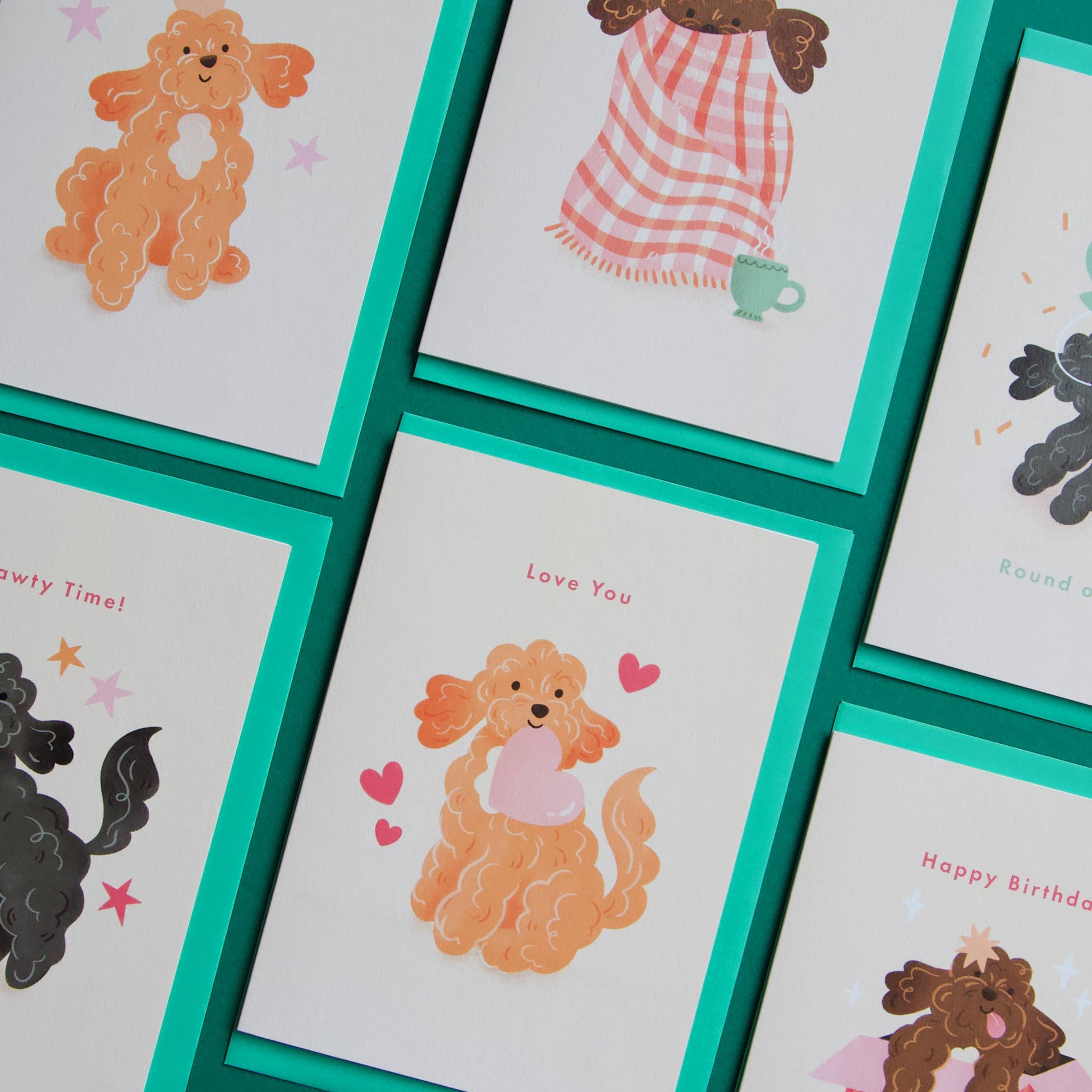 Collection of greeting cards with cartoon dog illustrations and text on a white background.