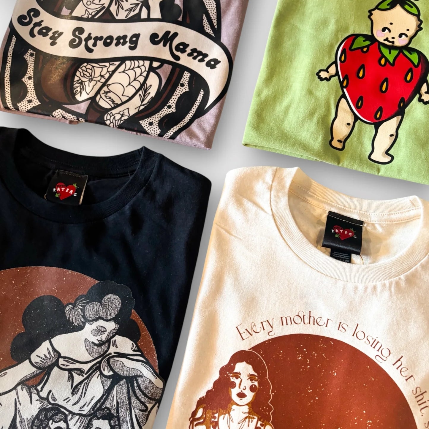 Collection of t-shirts with various designs on a white surface