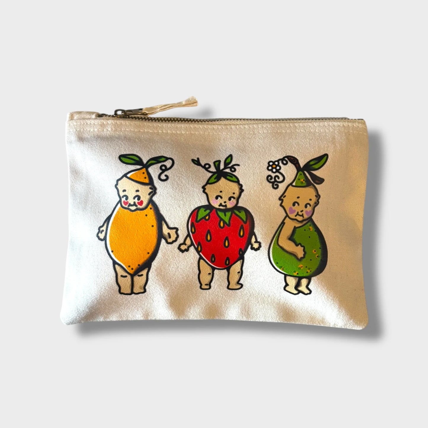 Pouch with cartoon characters in fruit costumes on a beige background