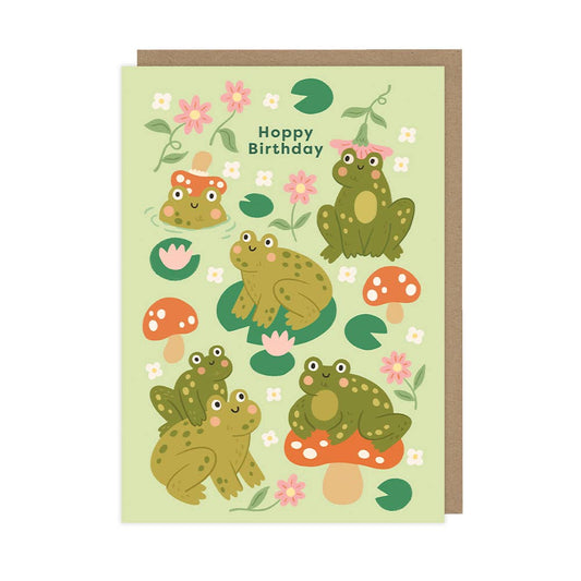 Birthday card with cartoon frogs and flowers on a light green background