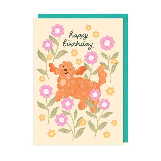 Birthday card with an orange dog illustration and flowers on a beige background