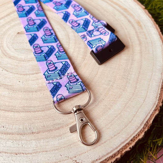 Lanyard with cartoon character pattern on a wooden surface