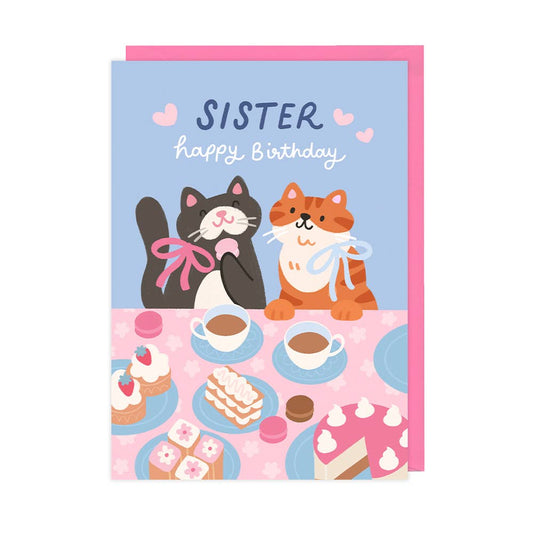 Birthday card with two cats, tea party theme, and 'Sister' text on a blue background.