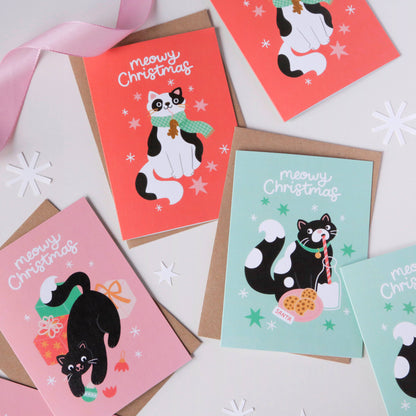 Set of Christmas cards with cat illustrations on a white background