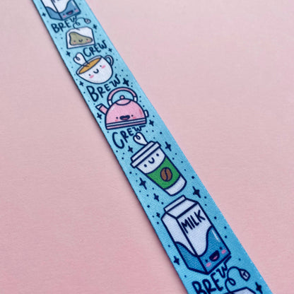 Wristband with cartoon coffee and milk designs on a pink background