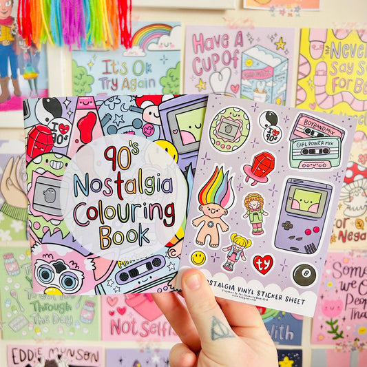 90s Nostalgia Colouring Book and Sticker Sheet held by a hand with colorful background