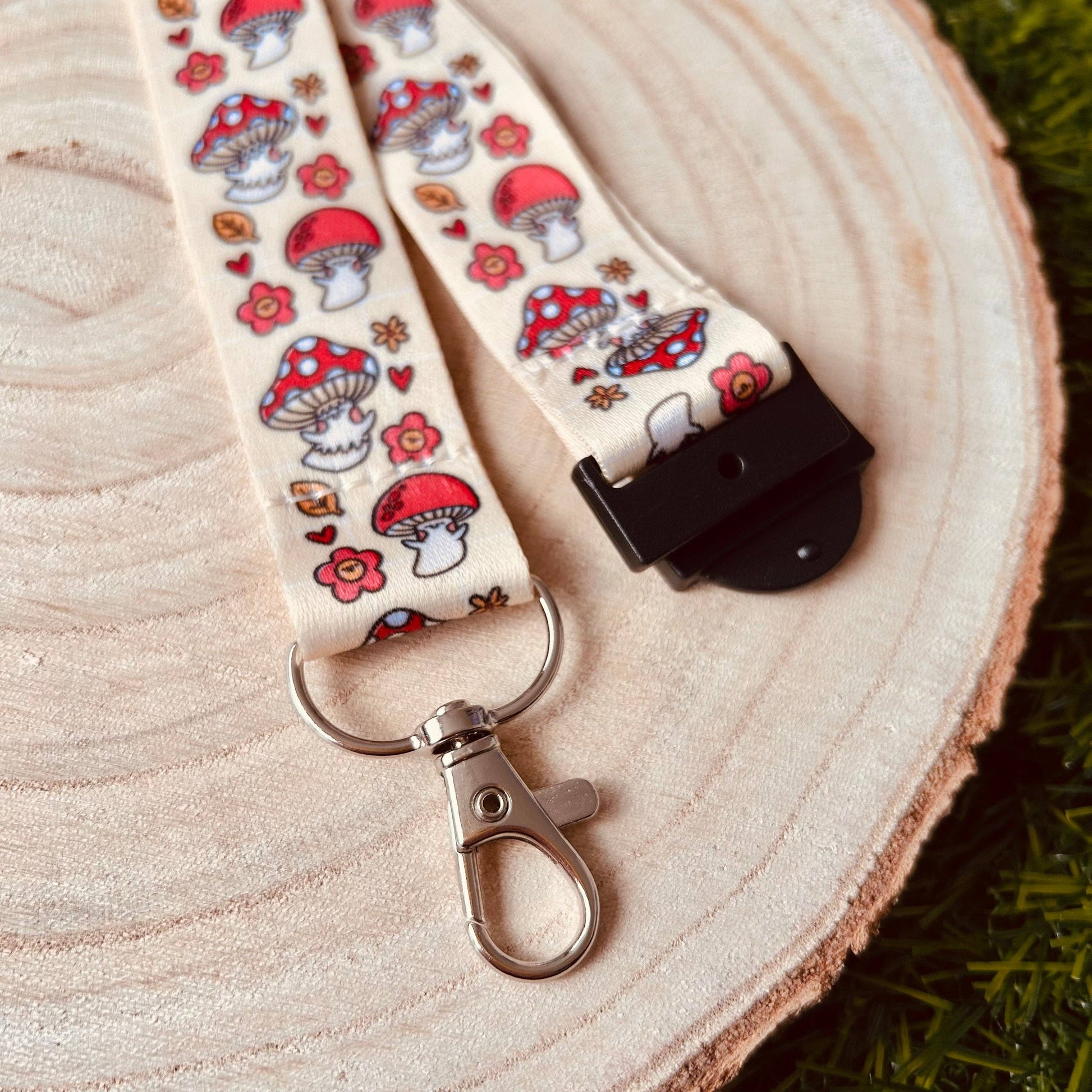 Lanyard with mushroom pattern on a wooden surface