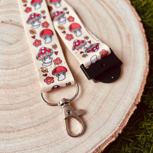 Lanyard with mushroom pattern on a wooden surface