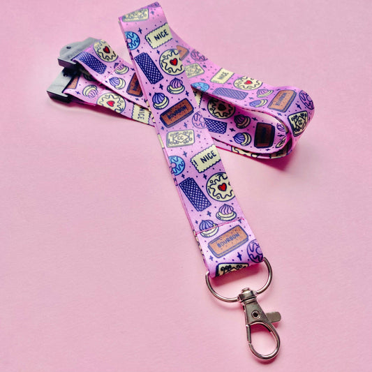 Pink lanyard with cartoon character design on a pink background